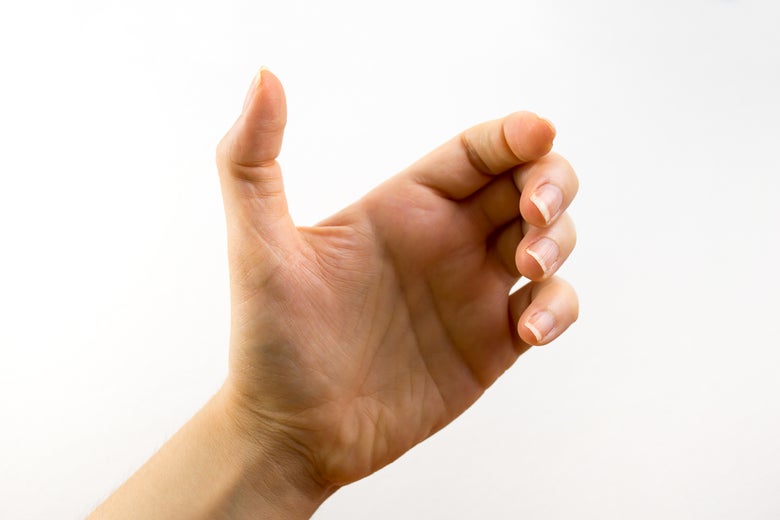 An empty hand cradles an imaginary cellphone.